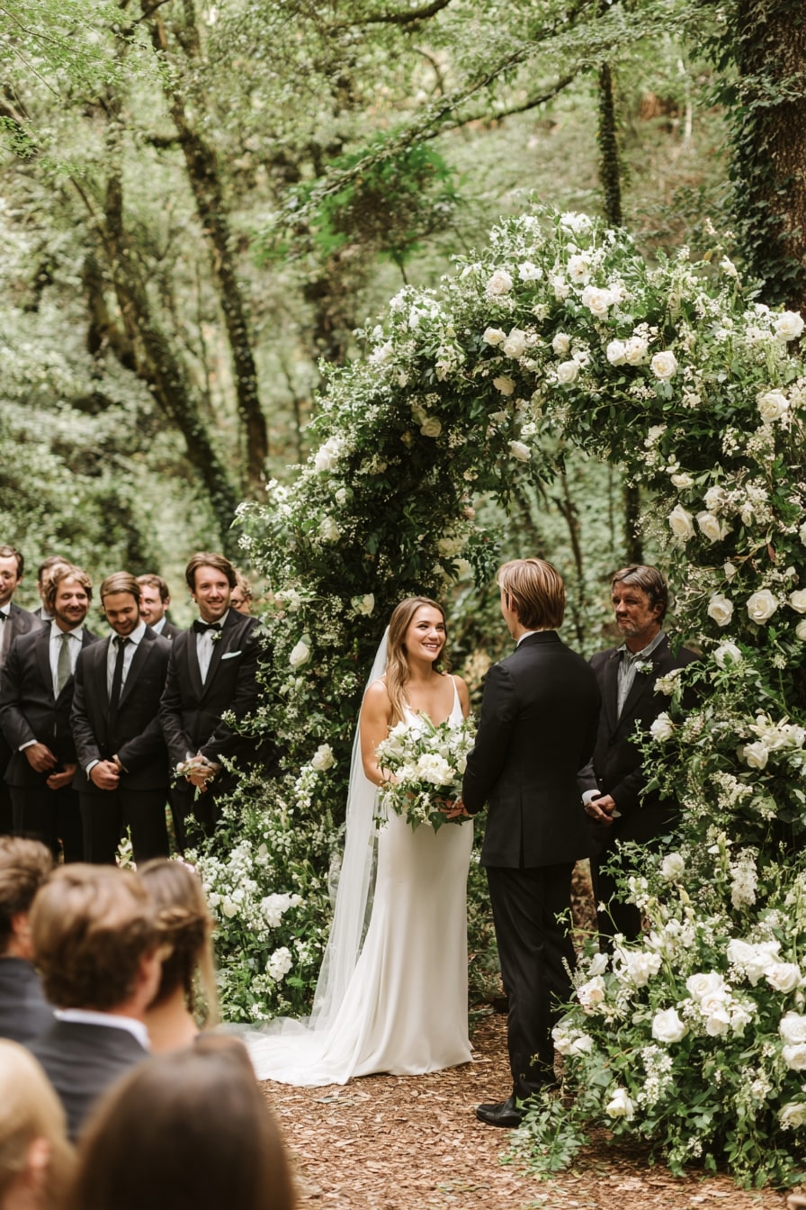 14. Blend Ceremony Space into a Forest Setting with a Greenery Arch